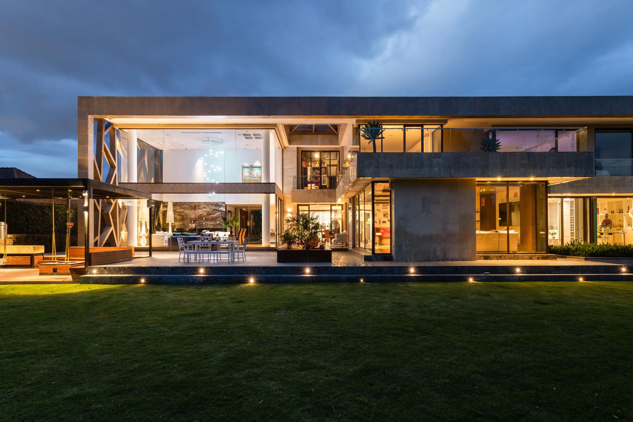 Contemporary villa facade illuminated at dusk