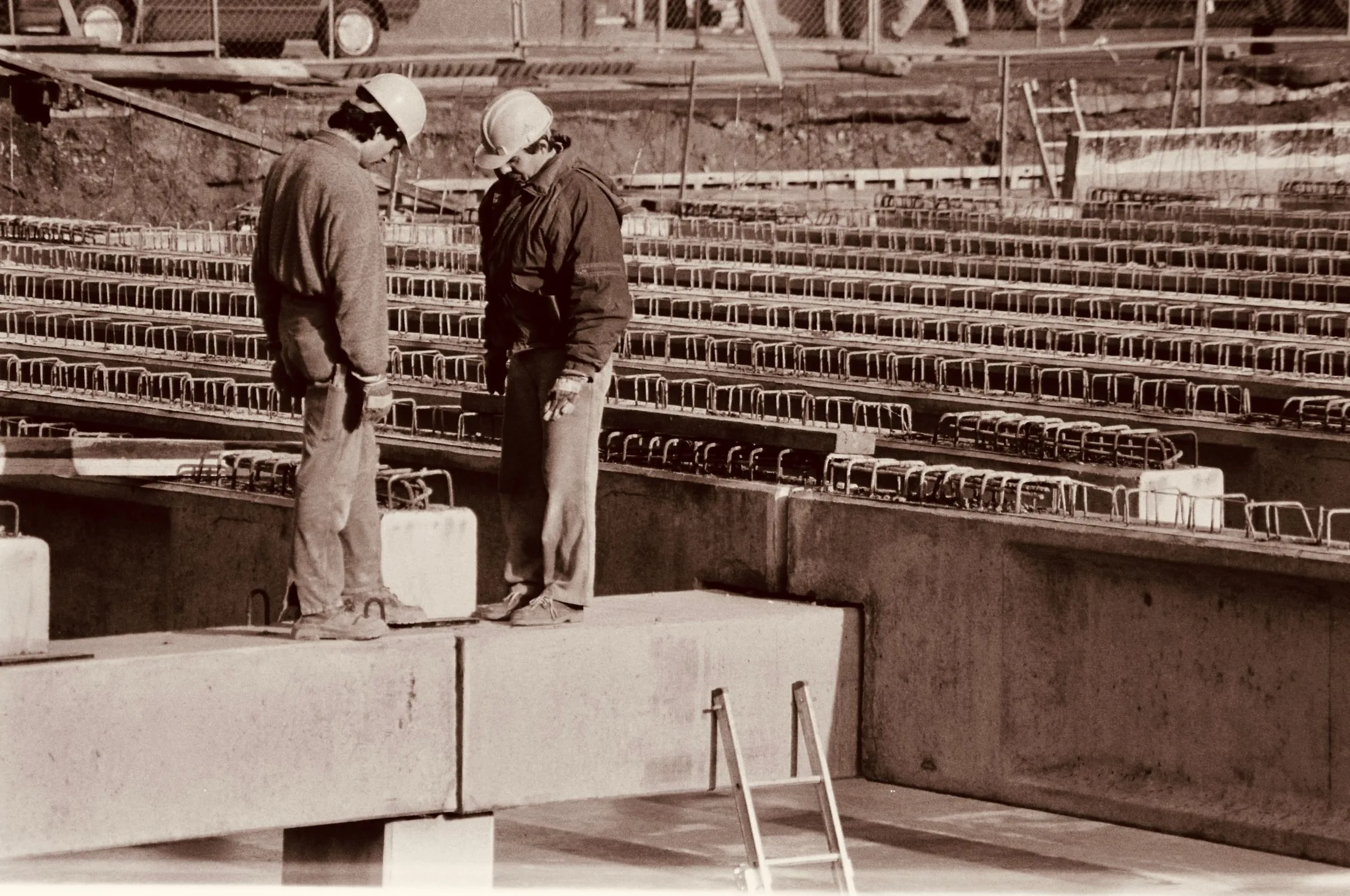 Builders reviewing a project plan at a construction site
