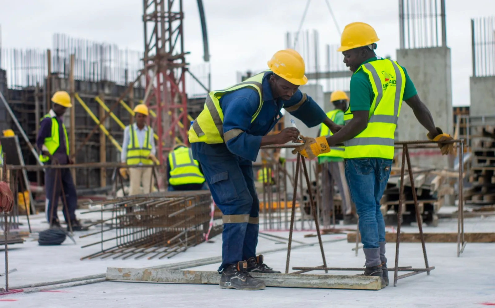 Construction workers coordinating on site