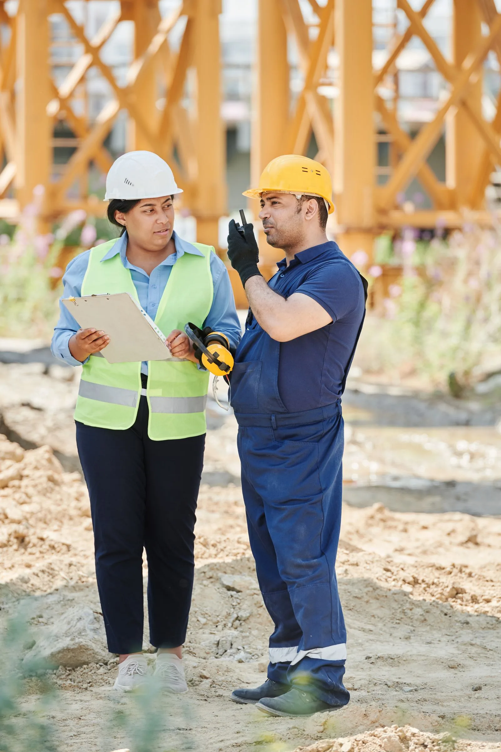 Site engineers reviewing construction plans